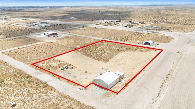 drone / aerial view with a rural view and a desert view