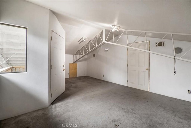 bonus room with visible vents, carpet floors, and lofted ceiling