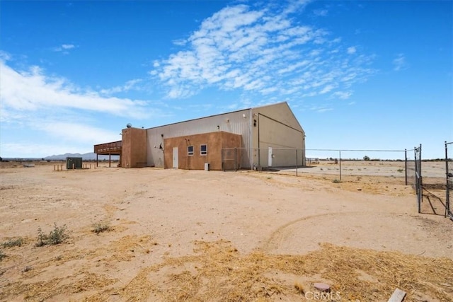 view of pole building featuring fence