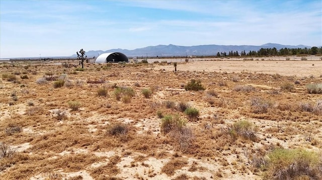view of mountain feature featuring a rural view