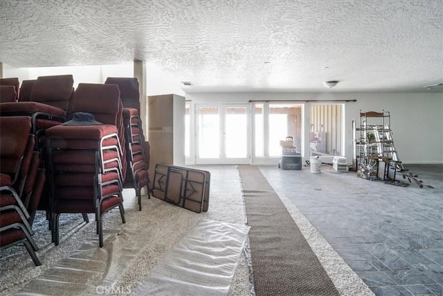 living room with a textured ceiling