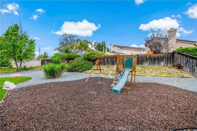 view of playground featuring a fenced backyard