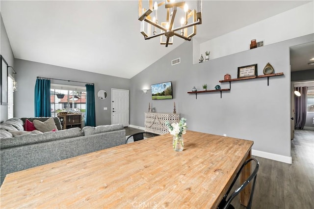 dining area featuring dark wood-style flooring, visible vents, high vaulted ceiling, and baseboards