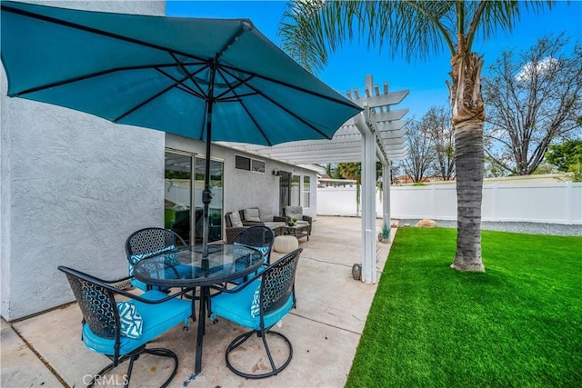 view of patio featuring outdoor dining space and fence