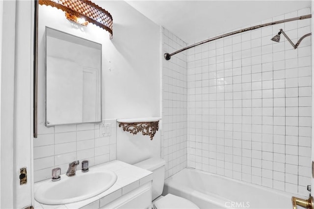 bathroom featuring tasteful backsplash, toilet, shower / tub combination, and vanity