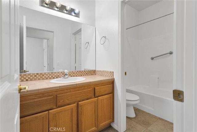 bathroom with vanity, toilet, tile patterned flooring, and tub / shower combination