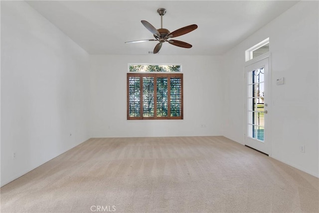 carpeted empty room with ceiling fan