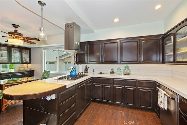 kitchen featuring glass insert cabinets, dark brown cabinetry, dark wood-style floors, and stainless steel appliances