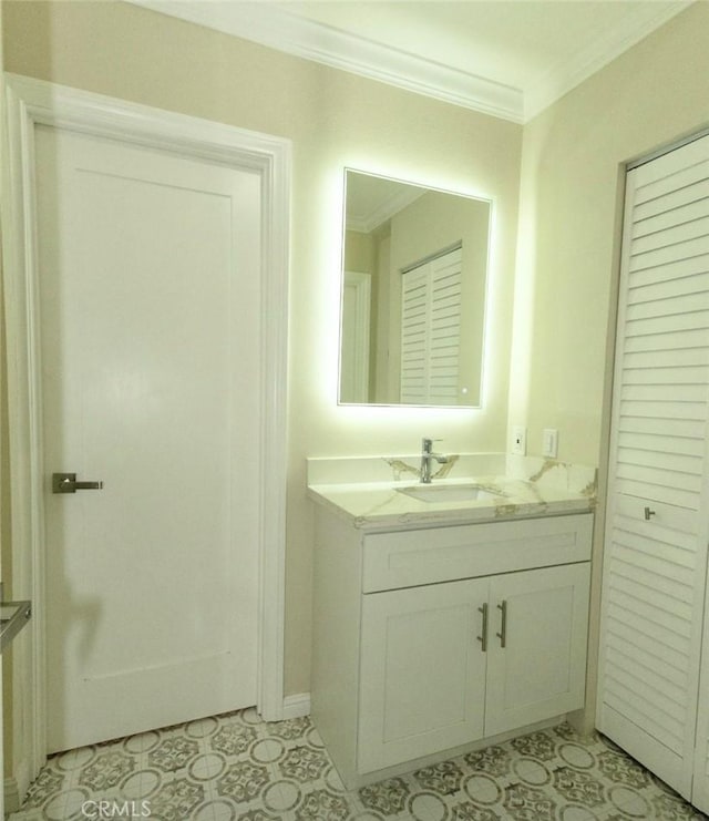 bathroom with vanity and crown molding