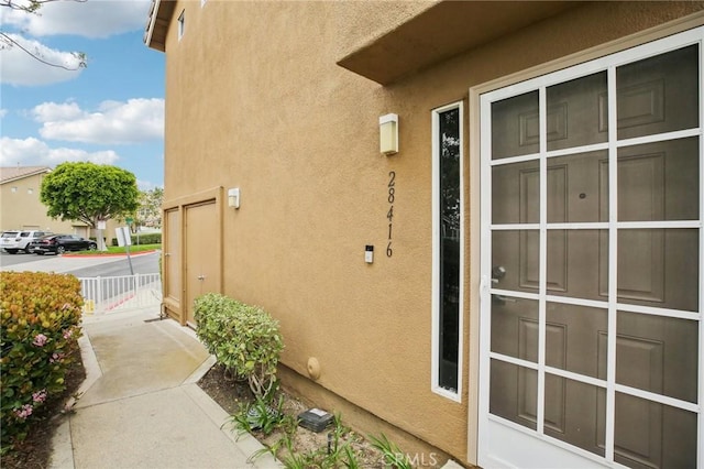 view of side of property featuring stucco siding