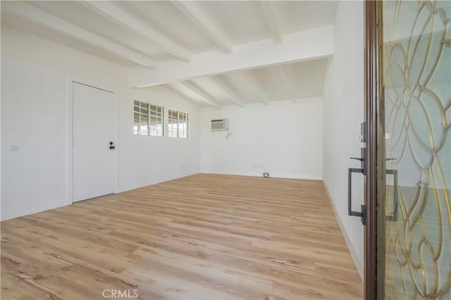 1976 Galemont Ave, Hacienda Heights, CA 91745 - spare room with a wall unit AC, vaulted ceiling with beams, and light wood-style floors