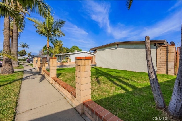 1976 Galemont Ave, Hacienda Heights, CA 91745 - view of side of property featuring stucco siding and a yard