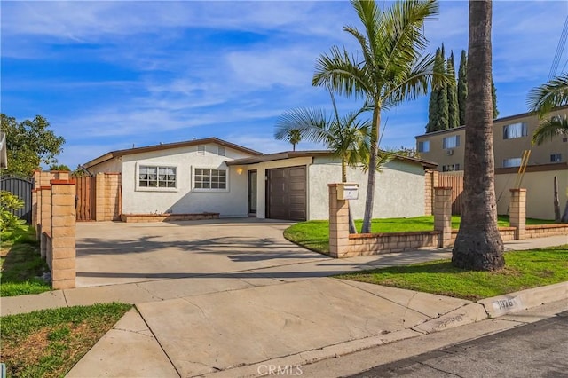 1976 Galemont Ave, Hacienda Heights, CA 91745 - view of front facade with driveway, fence, stucco siding, and an attached garage