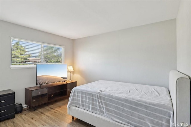 bedroom featuring wood finished floors