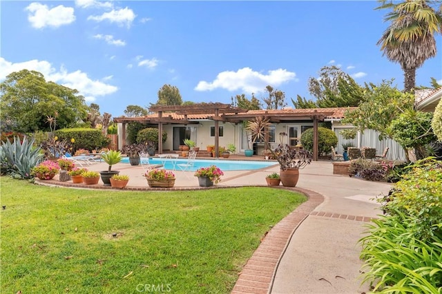 rear view of house with a lawn, an outdoor pool, a pergola, and a patio area