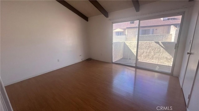 1224 Mohave Dr, Colton, CA 92324 - spare room featuring wood finished floors and vaulted ceiling with beams