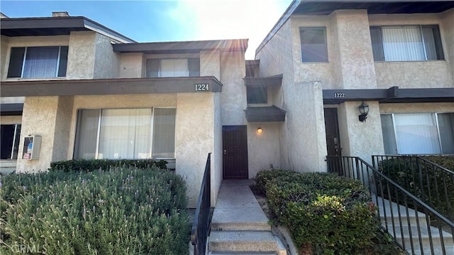 1224 Mohave Dr, Colton, CA 92324 - view of front of home with stairs and stucco siding