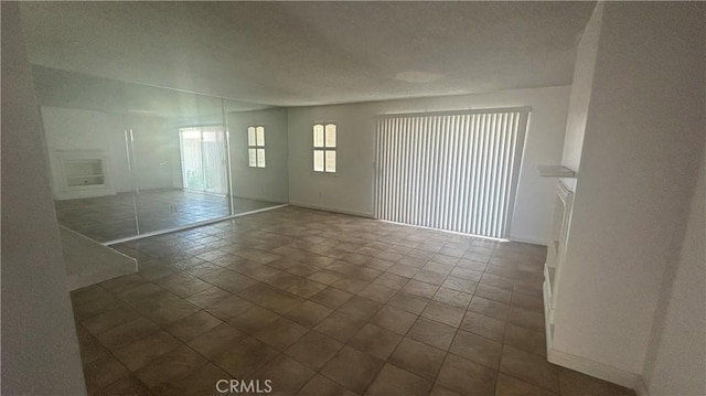1224 Mohave Dr, Colton, CA 92324 - spare room featuring baseboards