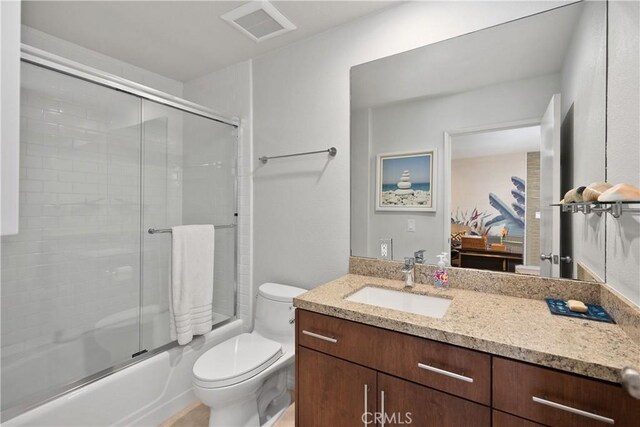31588 Table Rock Dr, Laguna Beach, CA 92651 - bathroom featuring toilet, vanity, and combined bath / shower with glass door
