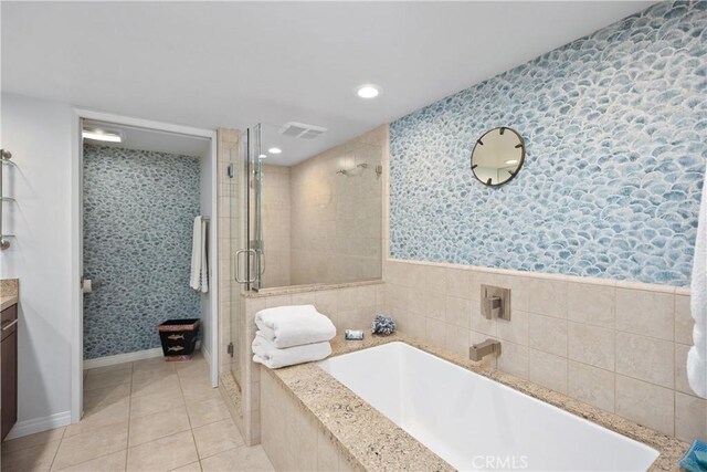 31588 Table Rock Dr, Laguna Beach, CA 92651 - bathroom with vanity, a stall shower, a garden tub, wallpapered walls, and tile patterned floors