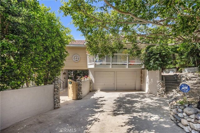 31588 Table Rock Dr, Laguna Beach, CA 92651 - view of front of house with concrete driveway and a balcony