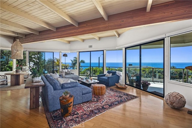 31588 Table Rock Dr, Laguna Beach, CA 92651 - living area with hardwood / wood-style floors, beam ceiling, a water view, and plenty of natural light