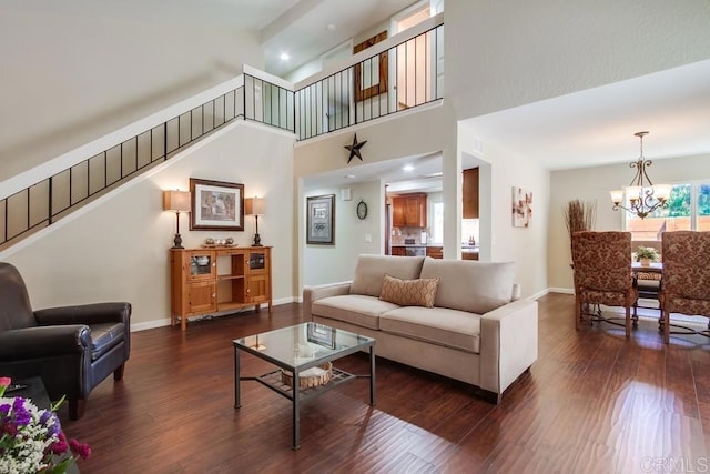 1023 Mimosa Ave, Vista, CA 92081 - living room featuring a chandelier, dark wood-style flooring, stairs, recessed lighting, and a high ceiling