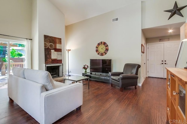 1023 Mimosa Ave, Vista, CA 92081 - living room with high vaulted ceiling, a fireplace, and dark wood-style floors