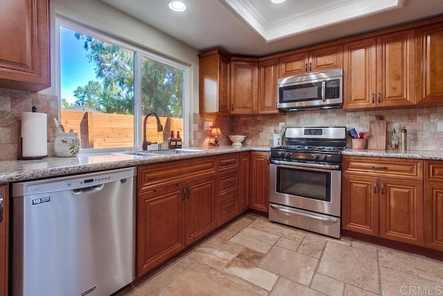 1023 Mimosa Ave, Vista, CA 92081 - kitchen featuring appliances with stainless steel finishes, brown cabinets, tasteful backsplash, ornamental molding, and recessed lighting