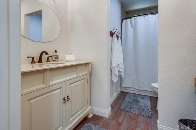 1023 Mimosa Ave, Vista, CA 92081 - bathroom featuring vanity, wood finished floors, and curtained shower