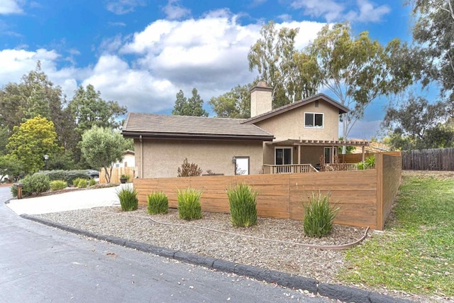1023 Mimosa Ave, Vista, CA 92081 - view of front facade featuring stucco siding and a chimney