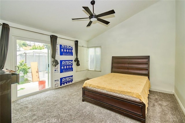 carpeted bedroom featuring baseboards, access to outside, vaulted ceiling, and multiple windows