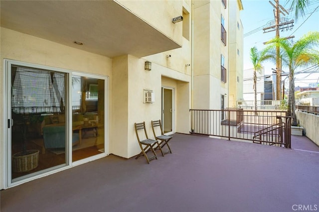 view of patio featuring a balcony