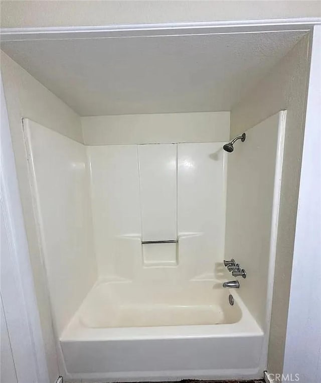 bathroom featuring washtub / shower combination