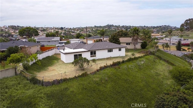 birds eye view of property with a residential view