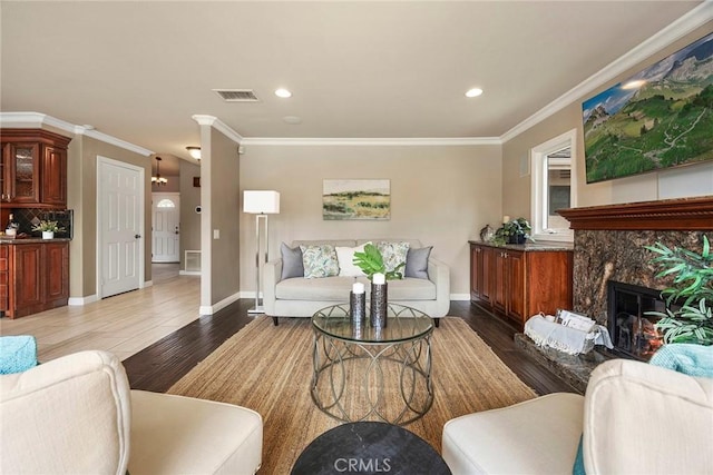 4820 Via Corzo, Yorba Linda, CA 92886 - living area with wood finished floors, crown molding, a premium fireplace, and recessed lighting