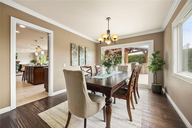 4820 Via Corzo, Yorba Linda, CA 92886 - dining space with a chandelier, healthy amount of natural light, baseboards, ornamental molding, and wood finished floors