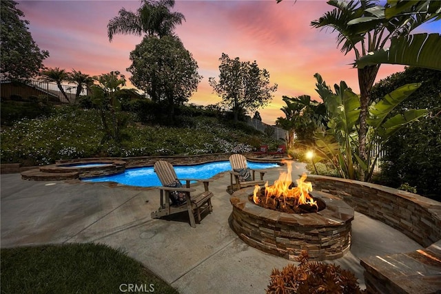 4820 Via Corzo, Yorba Linda, CA 92886 - pool at dusk with a fire pit, a patio area, and a pool with connected hot tub