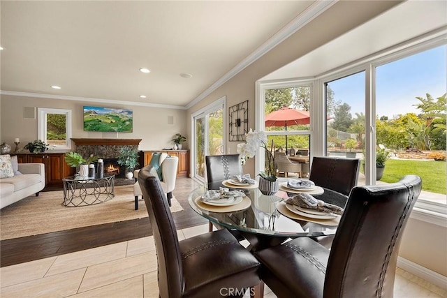 4820 Via Corzo, Yorba Linda, CA 92886 - dining area featuring a fireplace, crown molding, recessed lighting, baseboards, and wood finished floors