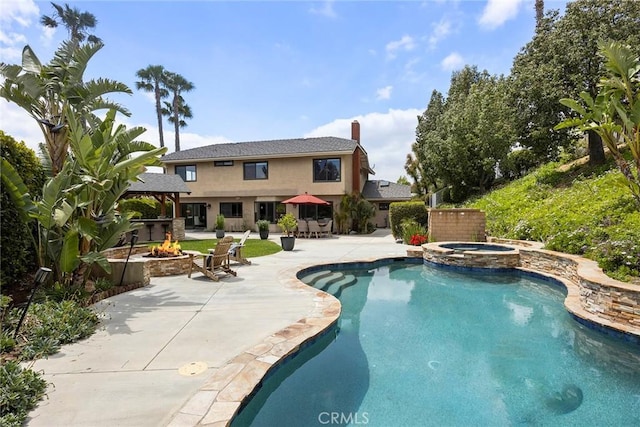 4820 Via Corzo, Yorba Linda, CA 92886 - view of swimming pool with a gazebo, a fire pit, a patio area, and a pool with connected hot tub