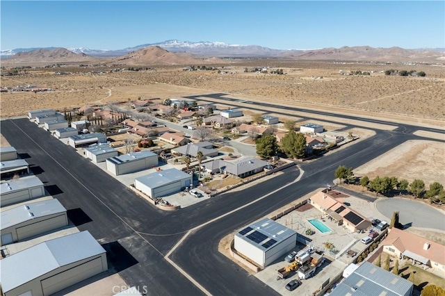 bird's eye view featuring a mountain view and view of desert