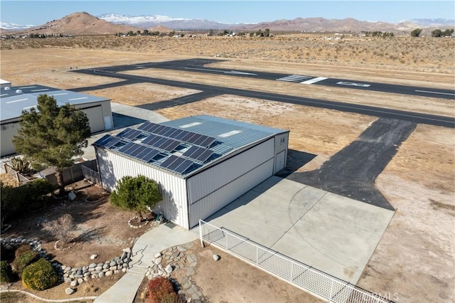 bird's eye view featuring a mountain view and view of desert