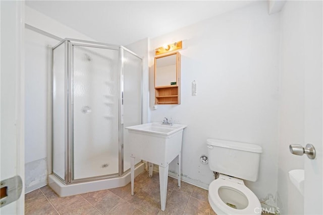 full bathroom with toilet and a stall shower