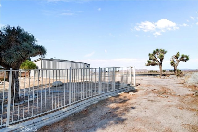 view of gate featuring fence