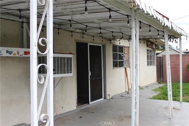 exterior space featuring a patio and stucco siding
