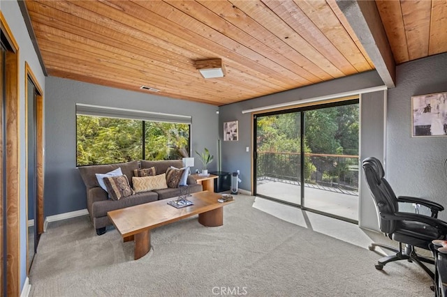 interior space featuring visible vents, baseboards, and wood ceiling