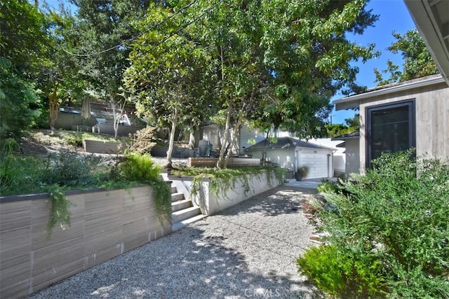 exterior space with driveway and a garage