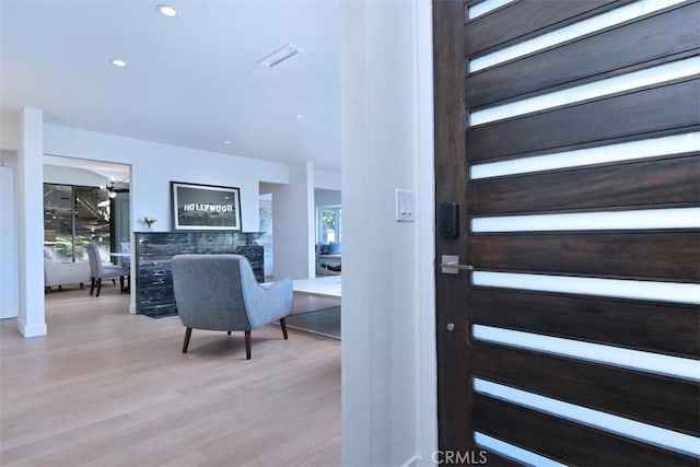 foyer entrance with wood finished floors, recessed lighting, and visible vents