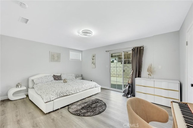 5211 Mcclintock Ave, Temple City, CA 91780 - bedroom featuring baseboards, access to exterior, and wood finished floors