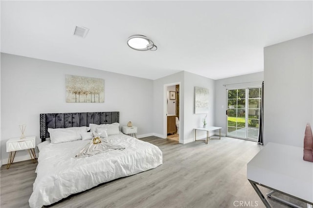 5211 Mcclintock Ave, Temple City, CA 91780 - bedroom with baseboards, visible vents, wood finished floors, and access to exterior